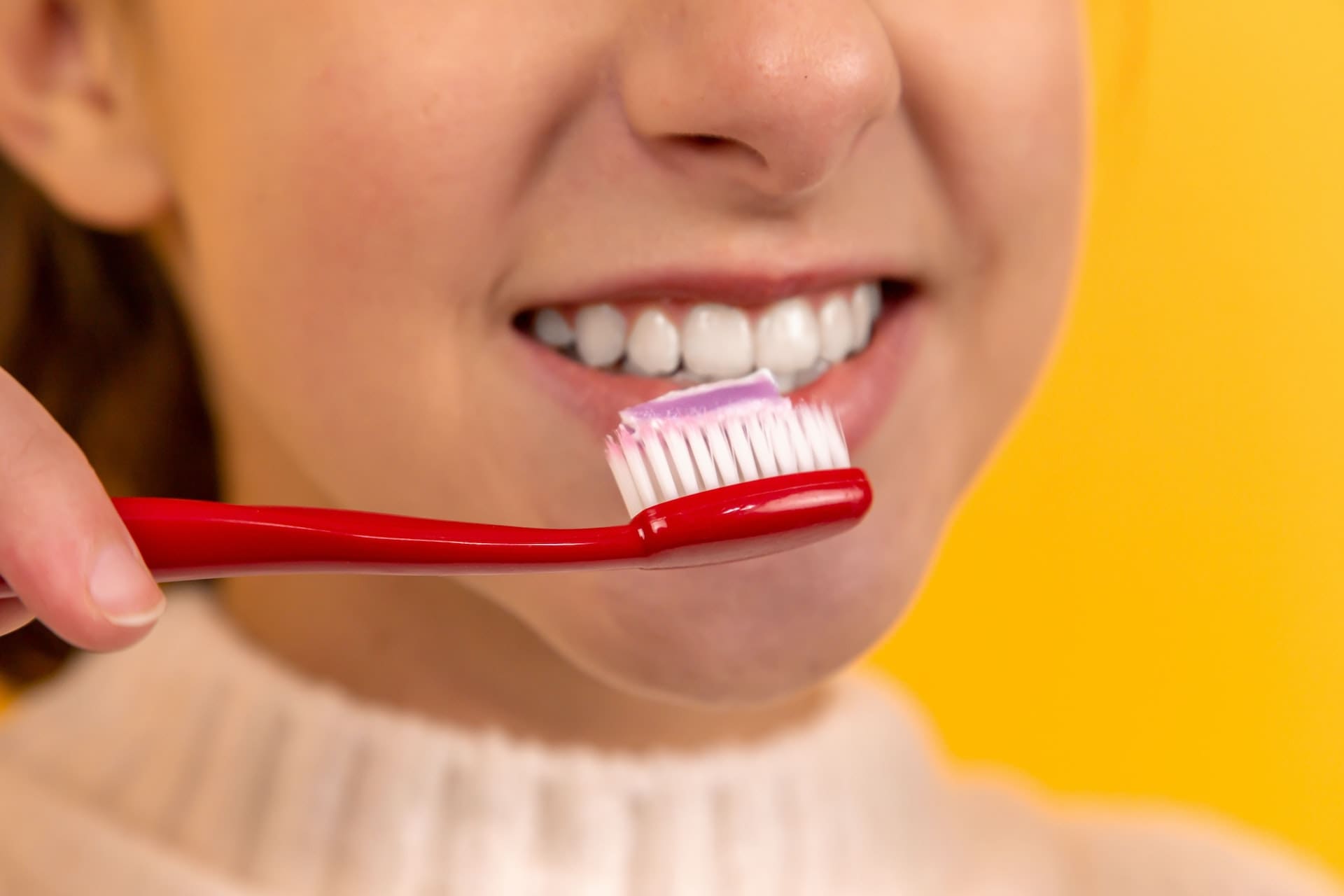 girl brushing her teeth